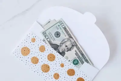 White envelope with cash tucked inside, wedding gift money