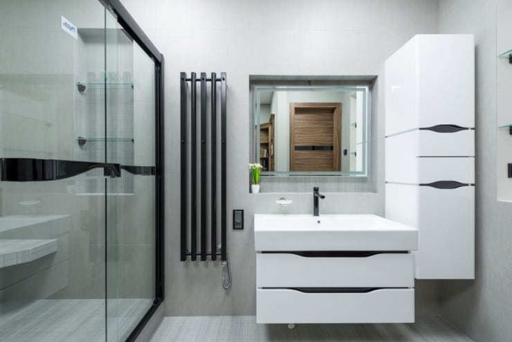How high should the mirror be above the vanity?